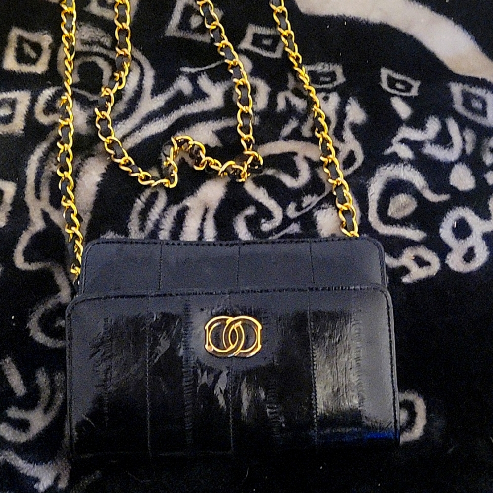 Comet genuine eel skin purse black gold